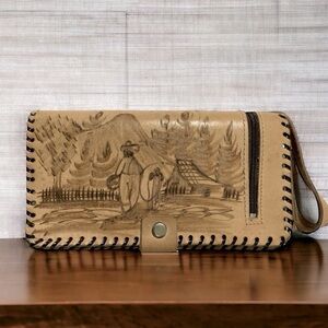 Handmade Tooled El Salvador wallet has lots of storage and inside mirror.